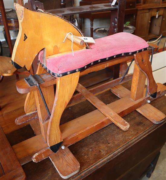 A 1940s primitive pine rocking horse, W.110cm, H.65cm